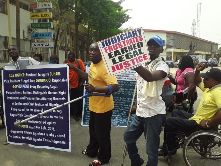 Disabled persons protest against non-payment of judgement sum