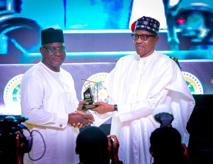 Mr. Muhammad Nami, Executive Chairman, FIRS receives Nigeria Excellence Award In Public Service for Fiscal Reforms from President Muhammadu Buhari, at the State House Conference Centre, Presidential Villa, Abuja on October 21, 2022