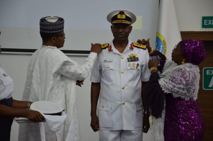 Naval Chief of Accounts and Budget, Rear Admiral Bushi being decorated