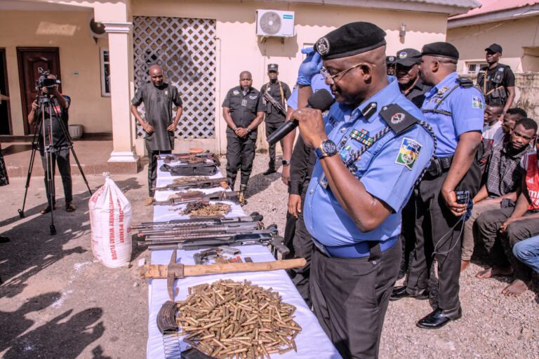 Police parade notorious arms dealer, arrests 1,246 suspects